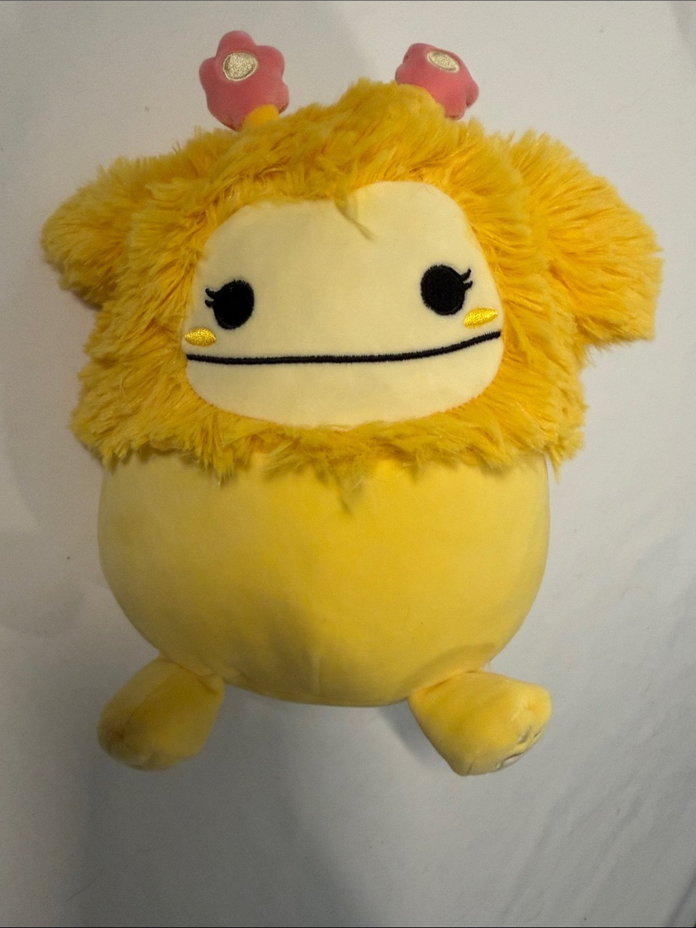 Yellow Squishmallow Nomi Character Pillow with Pink Flower Antennae